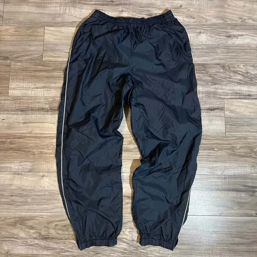 Vintage Men's Navy Blue Nylon Track Pants with White Side Piping and Zip Cuffs